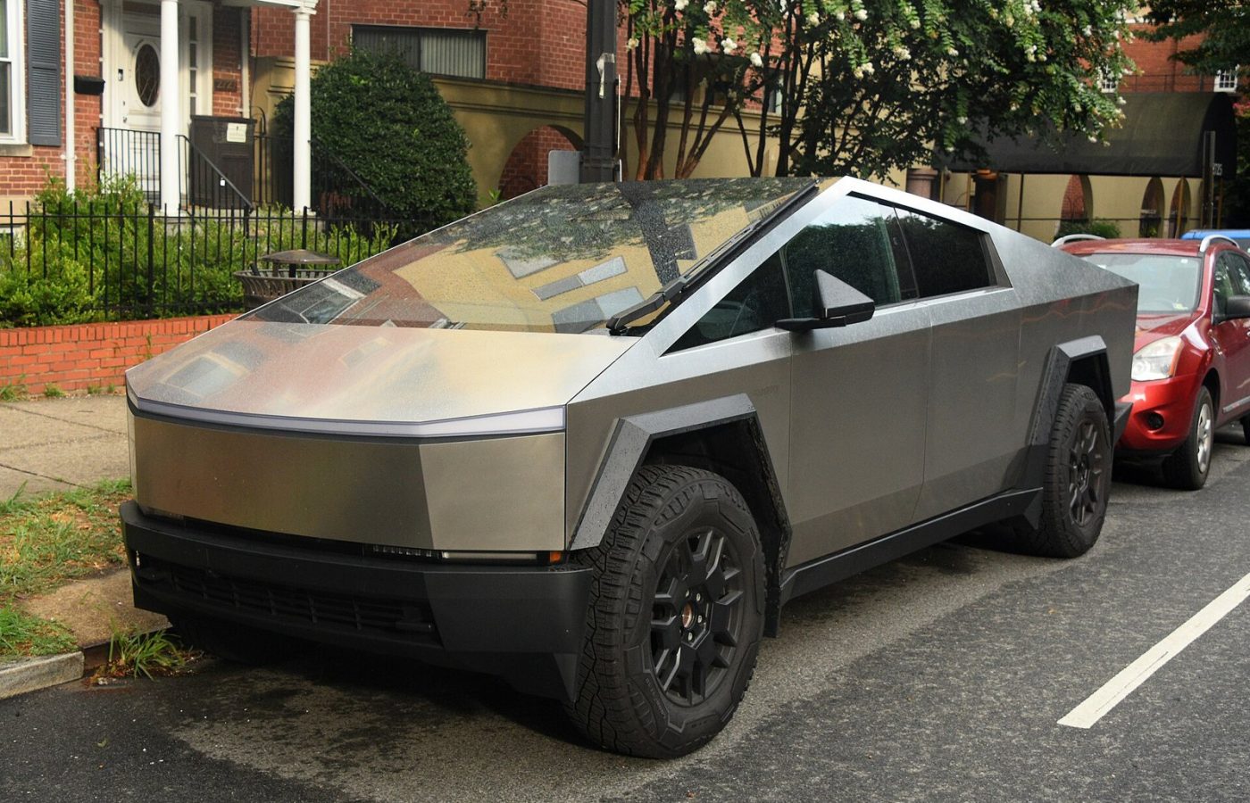Stainless steel Tesla Cybertruck parked outdoors
