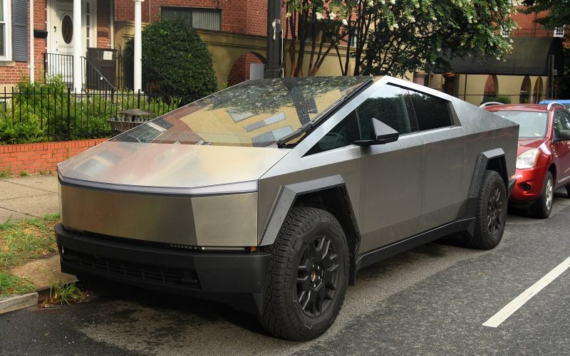Stainless steel Tesla Cybertruck parked outdoors