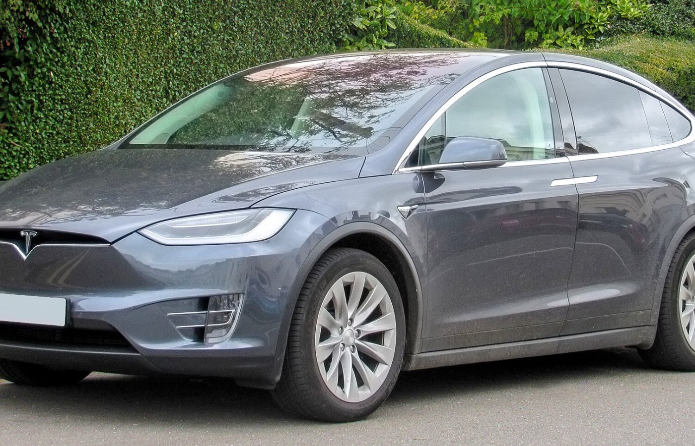 Front three-quarter view of a grey 2017 Tesla Model X parked on a street.
