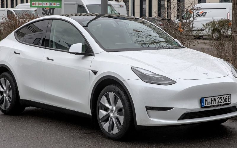 Tesla Model Y parked, side and front view