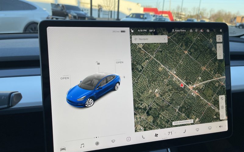 Tesla Model 3 centre touchscreen showing the car view and satellite navigation map